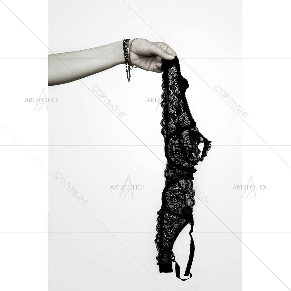 Female Arm Holding Up A Black Lace Bra — custom-size art design 5001213
